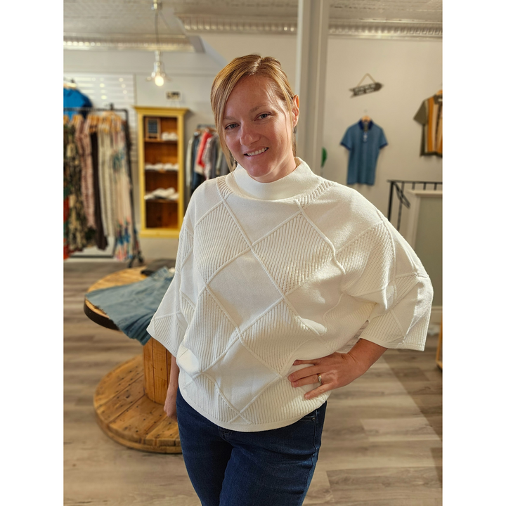 Suéter texturizado de punto con cuello alto