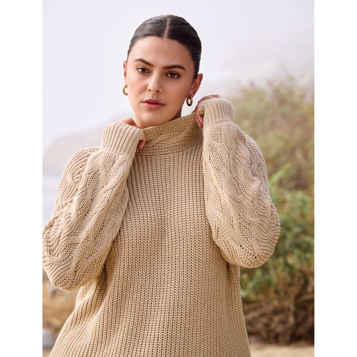 Pull à col montant en maille torsadée